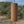 Koshi Mountain chime in walnut against a hillside landscape, video with the original sound of the Earth Symphony collection